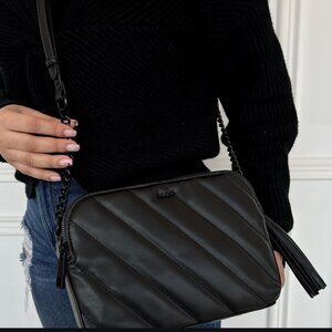 Aldo Talaedar quilted crossbody bag in black faux leather.